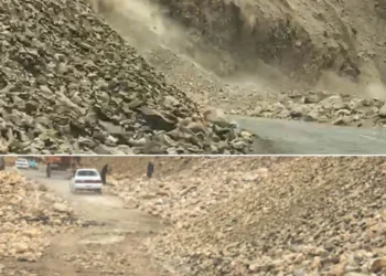 Rocks tumble down a mountainside in a cloud of dust, while a vehicle passes through a rubble-covered road in Panjshir amid ongoing CASA-1000 project work. (Photo credit: Exclusive)