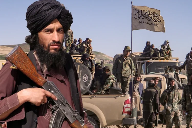 Taliban fighters sit in a vehicle displaying the Taliban flag. (Photo credit: EPA/AFP)