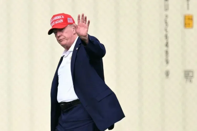 US President Donald Trump waves to the camera from a distance amid criticism of the Nobel Committee’s decision to award this year’s Peace Prize to Navi Pillay. (Photo credit: AFP)