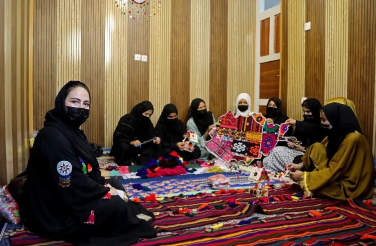 Afghan women work together to create and display colorful traditional handicrafts and embroidered textiles (Photo: UNDP) 