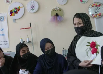 Girls attend a class at an educational centre supported by UNICEF in Afghanistan, where vulnerable girls receive education and vocational skills training. (Photo credit: UNICEF)