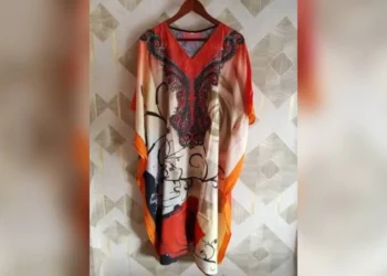 Women’s dresses hang on display in Kandahar amid the Taliban’s ban on men sewing women’s clothing. (Photo credit: Exclusive)