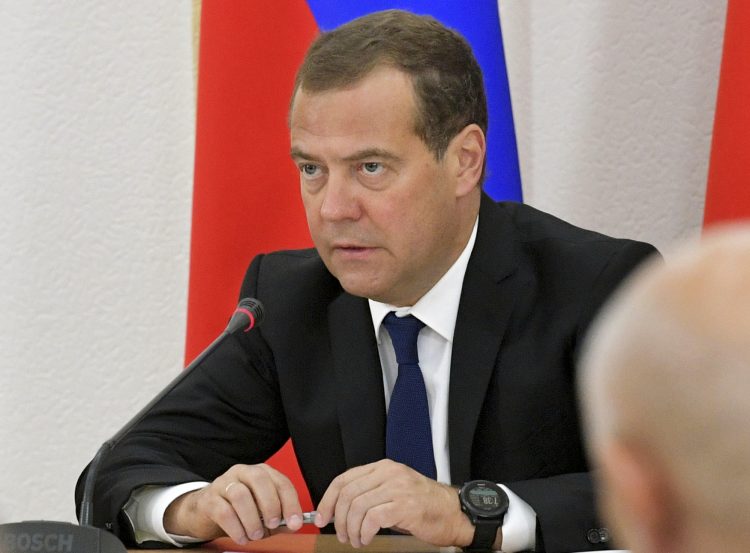Russian Prime Minister Dmitry Medvedev attends a meeting in Chita, Russia, Thursday, Aug. 1, 2019, with local government and Russian Emergency situations Ministry officials to discuss the wildfires in the region. Russian authorities have declared a state of emergency in five areas, including all of the Irkutsk and Krasnoyarsk regions, which lie north of Mongolia. (Alexander Astafyev, Sputnik, Government Pool Photo via AP)